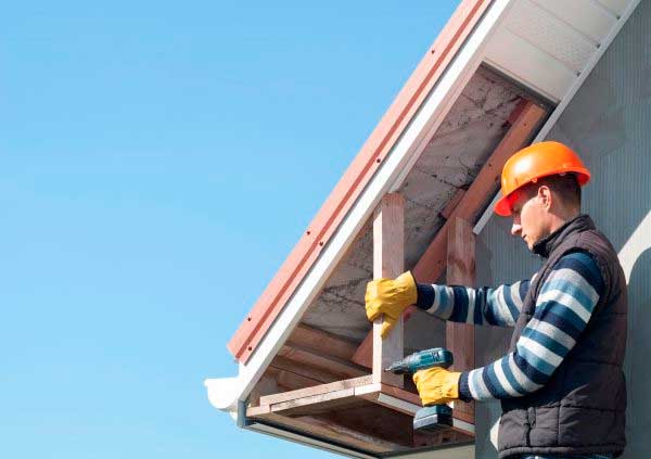 Operator installing a soffit support