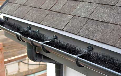 Renewed black metal gutters