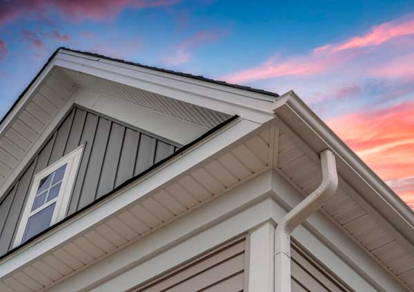 White plastic gutter in a brown house