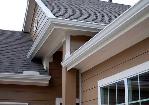 White metal gutter in a brown house