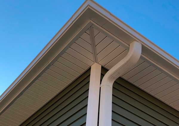 White plastic gutter renewal in a green house