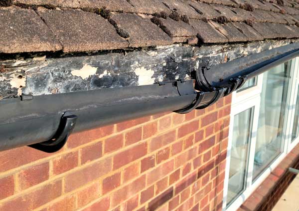 Broken black plastic gutter