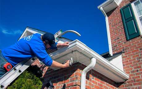 Man repairing a Gutter