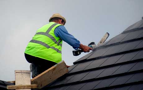 Operator reparing a roof leak