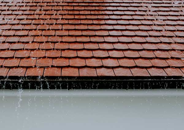 Red tiles roof raining