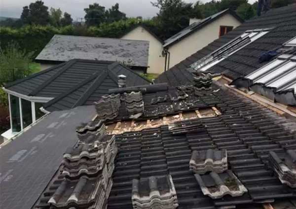 Re-roofing of an entire roof using black tiles