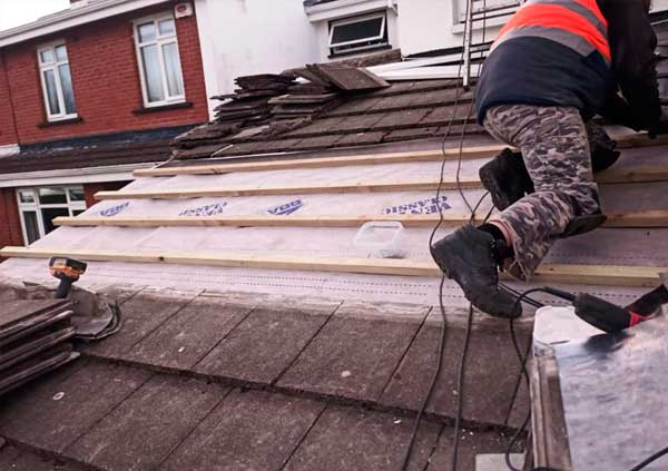 Operator performing a roof replacement in Cork