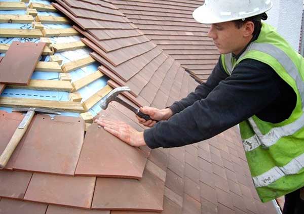 Operator re-roofng a roof