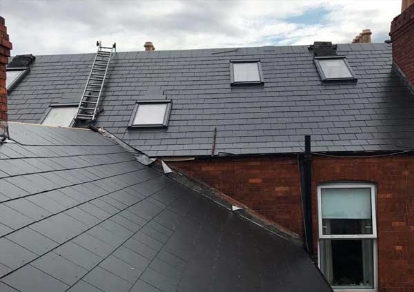 Roof with black slates and skylights