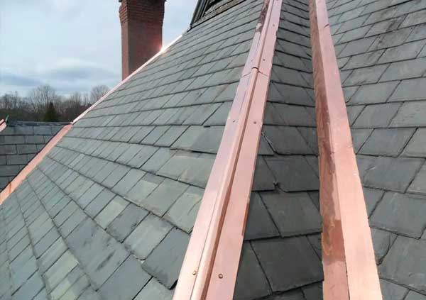 Coopper ridges restoration on a slate roof